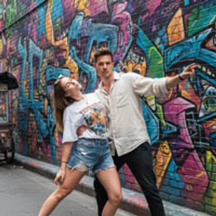 Couple posing with Bangkok street art